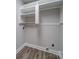 Laundry room offers built-in shelving and vinyl flooring at 526 Manchester Rd, Mount Gilead, NC 27306
