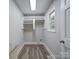 Laundry room with built-in shelving and vinyl flooring at 526 Manchester Rd, Mount Gilead, NC 27306