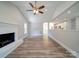 Living room with fireplace, hardwood floors and kitchen view at 526 Manchester Rd, Mount Gilead, NC 27306