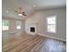 Spacious living room with hardwood floors and fireplace at 526 Manchester Rd, Mount Gilead, NC 27306