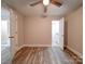 Bedroom with hardwood floors, ceiling fan and en-suite bathroom at 526 Manchester Rd, Mount Gilead, NC 27306