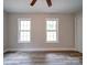 Bright bedroom with two large windows and wood-look flooring at 526 Manchester Rd, Mount Gilead, NC 27306