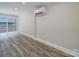 Spacious bonus room with wood-look flooring and sliding glass door at 526 Manchester Rd, Mount Gilead, NC 27306