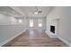 Bright living room with fireplace and hardwood floors at 526 Manchester Rd, Mount Gilead, NC 27306