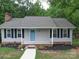 Newly renovated ranch home with gray siding and blue door at 526 Manchester Rd, Mount Gilead, NC 27306