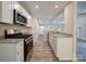 Modern kitchen with stainless steel appliances and granite countertops at 526 Manchester Rd, Mount Gilead, NC 27306