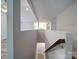 Modern staircase leading to the lower level at 526 Manchester Rd, Mount Gilead, NC 27306