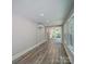 Bright dining room with wood-look flooring and sunroom access at 526 Manchester Rd, Mount Gilead, NC 27306