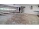 Unfinished garage with overhead door and space for storage and utilities at 526 Manchester Rd, Mount Gilead, NC 27306