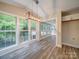 Bright dining room with hardwood floors and access to sunroom at 526 Manchester Rd, Mount Gilead, NC 27306