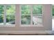 Room with large windows overlooking a wooded area and deck at 526 Manchester Rd, Mount Gilead, NC 27306