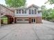 Brick and siding home with attached garage, deck, and ample parking at 526 Manchester Rd, Mount Gilead, NC 27306