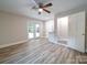 Living area with hardwood floors, French doors to backyard, and wet bar at 526 Manchester Rd, Mount Gilead, NC 27306