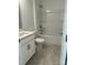 Bathroom with shower/tub combo, white vanity, and tile flooring at 105 Goorawing Ln, Mooresville, NC 28115