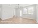 Bright and airy living room with hardwood floors and neutral walls at 10607 Audubon Ridge Dr # 27, Cornelius, NC 28031