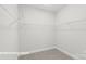 Spacious walk-in closet with wire shelving; provides ample storage at 10607 Audubon Ridge Dr # 27, Cornelius, NC 28031
