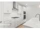 Modern kitchen with stainless steel appliances and white shaker cabinets at 10607 Audubon Ridge Dr # 27, Cornelius, NC 28031