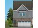 Exterior of townhome with garage at 10607 Audubon Ridge Dr # 27, Cornelius, NC 28031