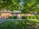 Brick ranch house with well-manicured landscaping at 806 Lee St, Kings Mountain, NC 28086