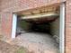 Unfinished basement garage with gravel floor at 469 Radio Rd, Taylorsville, NC 28681