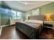 Spacious bedroom with large bed and wood floors at 469 Radio Rd, Taylorsville, NC 28681