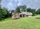 Brick home nestled on a tree-lined street at 469 Radio Rd, Taylorsville, NC 28681