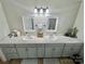 Double vanity bathroom with granite countertops and mirrors at 469 Radio Rd, Taylorsville, NC 28681