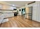 Modern kitchen features white cabinets, granite countertops, and stainless steel appliances at 469 Radio Rd, Taylorsville, NC 28681