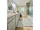 Bathroom with double sinks, granite countertop, and shower at 469 Radio Rd, Taylorsville, NC 28681
