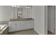 Elegant bathroom with double vanity, granite countertop, and a large mirror at 128 Stibbs Cross Rd, Mooresville, NC 28115