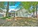 Back of house with screened porch and landscaping at 6236 Old Corral St, Charlotte, NC 28277