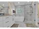 Main bathroom with soaking tub, shower and double vanity at 6236 Old Corral St, Charlotte, NC 28277