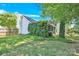 Side of house showing a screened porch and ivy at 6236 Old Corral St, Charlotte, NC 28277