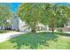 Charming single story home with green lawn and mature trees at 6236 Old Corral St, Charlotte, NC 28277