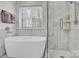 Bathroom with a freestanding soaking tub and shower at 6236 Old Corral St, Charlotte, NC 28277