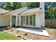 House exterior featuring light green door and shutters at 6236 Old Corral St, Charlotte, NC 28277