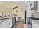 Updated kitchen with island, stainless steel appliances, and hardwood floors at 6236 Old Corral St, Charlotte, NC 28277