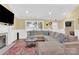 Spacious living room featuring a cozy sectional sofa and fireplace at 6236 Old Corral St, Charlotte, NC 28277