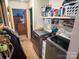 Functional laundry room, washer, dryer, and ample shelving at 1470 River Hills Ct, Taylorsville, NC 28681