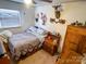 Cozy bedroom with a full-size bed and wood dresser at 1470 River Hills Ct, Taylorsville, NC 28681