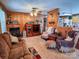 Living room with wood walls, fireplace, and comfortable seating at 1470 River Hills Ct, Taylorsville, NC 28681