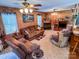 Living room with wood walls, fireplace, and comfy seating at 1470 River Hills Ct, Taylorsville, NC 28681