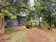 Chicken coop nestled amongst trees in a rural setting at 1470 River Hills Ct, Taylorsville, NC 28681