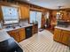 Eat-in kitchen featuring wood cabinets and a view to the backyard at 1470 River Hills Ct, Taylorsville, NC 28681
