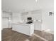 Modern kitchen with white cabinets, quartz countertops, and an island at 1029 Bull Dog Ln, Wingate, NC 28174