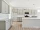 Modern kitchen with gray cabinets, quartz countertops, and stainless steel appliances at 1035 Bull Dog Ln, Wingate, NC 28174