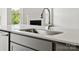 Kitchen island with sink, faucet, and white quartz countertop at 1035 Bull Dog Ln, Wingate, NC 28174