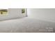 Bright bedroom with neutral walls and carpet, featuring two large windows at 1035 Bull Dog Ln, Wingate, NC 28174