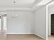 Bright dining room with hardwood floors and modern chandelier at 1035 Bull Dog Ln, Wingate, NC 28174