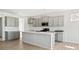 Modern kitchen with gray cabinets, quartz countertops, and stainless steel appliances at 1035 Bull Dog Ln, Wingate, NC 28174